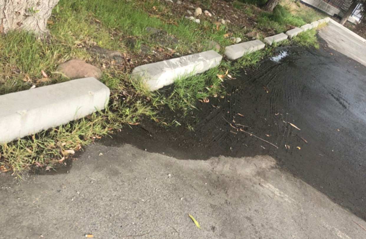 Stormwater Violation - AQUALIS stormwater violation of a wet parking lot