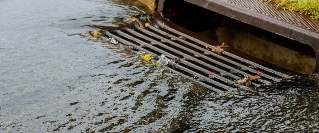 Stormwater flows into catch basin