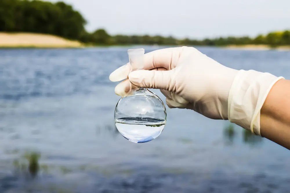 A water sample from the river. Water intake. Water abstraction. Water diversion