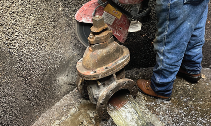 AQUALIS employee removing the old valve