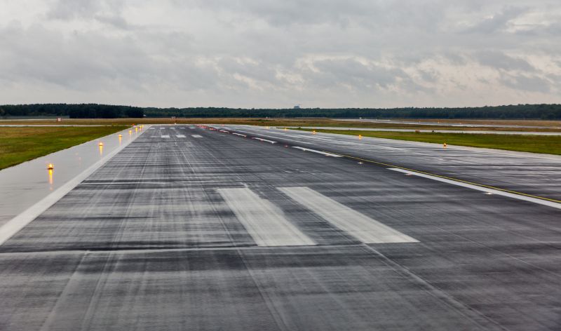 airport runway in the rain